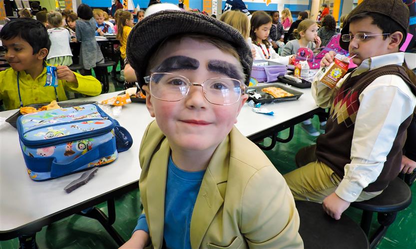 A student smiles